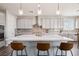 Stylish kitchen featuring an island with seating, stainless steel appliances, and modern pendant lights at 172 Lunga Ave, Henderson, NV 89011