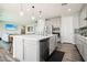 Modern kitchen featuring a large island with stainless steel appliances and seating at 172 Lunga Ave, Henderson, NV 89011
