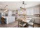 This open-concept kitchen and dining area is perfect for entertaining with a spacious island and modern appliances at 172 Lunga Ave, Henderson, NV 89011