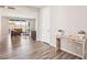 Bright living room boasts wood-look floors, neutral tones, and open layout to a backyard view at 172 Lunga Ave, Henderson, NV 89011