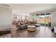Open-concept living room and kitchen area with wood flooring and access to the backyard at 172 Lunga Ave, Henderson, NV 89011