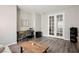 Cozy office space with desk, wood floors, and bright white french doors at 172 Lunga Ave, Henderson, NV 89011