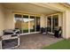 Covered patio with brick pavers, sliding glass doors, and outdoor grill, perfect for entertaining at 172 Lunga Ave, Henderson, NV 89011