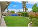 Large backyard with above ground pool, mature trees, and lush landscaping, offering privacy and serenity at 1780 Crystal Stream Ave, Henderson, NV 89012