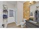 Stylish bathroom featuring a vanity with a vessel sink, and a unique tile accent wall at 1780 Crystal Stream Ave, Henderson, NV 89012