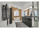 Modern bathroom features a soaking tub, contemporary lighting, and sleek black vanity at 1780 Crystal Stream Ave, Henderson, NV 89012