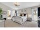 Stylishly decorated bedroom with neutral tones, ceiling fan, and access to the outdoor space at 1780 Crystal Stream Ave, Henderson, NV 89012