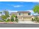 Charming two-story home featuring a three-car garage, mature trees, and well-maintained landscaping at 1780 Crystal Stream Ave, Henderson, NV 89012