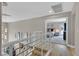 Bright hallway leads to a cozy bedroom with a walkout to a landscaped outdoor space at 1780 Crystal Stream Ave, Henderson, NV 89012