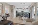 Open concept living room showcasing an eat-in island, stainless steel appliances, and modern design at 1780 Crystal Stream Ave, Henderson, NV 89012