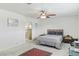 Bedroom featuring neutral walls, a modern bed frame and bedding and an ensuite bathroom at 1912 Parkchester Dr, Las Vegas, NV 89108