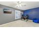 Bedroom with gray and blue walls, ceiling fan and a window with shutters at 1912 Parkchester Dr, Las Vegas, NV 89108