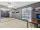 Spacious bedroom features a ceiling fan, large window, and mirrored closet doors at 1912 Parkchester Dr, Las Vegas, NV 89108