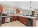 Bright kitchen features stainless steel appliances, tile countertops, and a built-in beverage cooler at 1912 Parkchester Dr, Las Vegas, NV 89108
