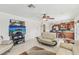 Open-concept living room and kitchen, featuring tile floors and contemporary furnishings at 1912 Parkchester Dr, Las Vegas, NV 89108