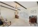 Bright living room with beamed ceilings, large windows with shutters, and comfortable seating at 1912 Parkchester Dr, Las Vegas, NV 89108