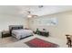 Neutral main bedroom with ceiling fan, shutters, rug, and an exercise bike at 1912 Parkchester Dr, Las Vegas, NV 89108