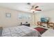 Spacious main bedroom featuring a ceiling fan, large window, and a cozy area rug at 1912 Parkchester Dr, Las Vegas, NV 89108