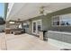Large, shaded patio with an outdoor kitchen, perfect for entertaining and enjoying the outdoors at 1912 Parkchester Dr, Las Vegas, NV 89108