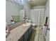 Bathroom featuring a single sink vanity, toilet, and shower/tub combination with curtain at 2016 Mesquite Ln # 302, Laughlin, NV 89029