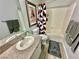 Bathroom featuring a single sink vanity, toilet, and shower/tub combination at 2016 Mesquite Ln # 302, Laughlin, NV 89029