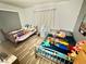 Shared bedroom with two twin beds, soft lighting, and warm wood-look flooring at 2016 Mesquite Ln # 302, Laughlin, NV 89029