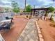 A paved pathway leads to a community barbecue and picnic area with lush landscaping at 2016 Mesquite Ln # 302, Laughlin, NV 89029