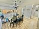 Dining area with modern chandelier and view into updated kitchen at 2016 Mesquite Ln # 302, Laughlin, NV 89029