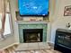 Tiled fireplace with mounted television and decorative mantel at 2016 Mesquite Ln # 302, Laughlin, NV 89029