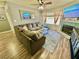 Bright living room with a fireplace, ceiling fan, and comfortable sectional sofa at 2016 Mesquite Ln # 302, Laughlin, NV 89029