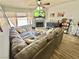 Cozy living room with a fireplace, ceiling fan, and comfortable sectional sofa at 2016 Mesquite Ln # 302, Laughlin, NV 89029