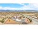 Aerial view of a well-maintained single-story home with solar panels in a desert environment at 2020 S Omaha Ave, Pahrump, NV 89048