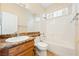 Bright bathroom with granite countertop, shower and tub combination, and tiled floor at 2020 S Omaha Ave, Pahrump, NV 89048