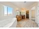 Bright bathroom features a soaking tub, double sinks, and large window at 2020 S Omaha Ave, Pahrump, NV 89048