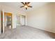 Bedroom with carpet, ceiling fan, mirrored sliding closet doors, and neutral wall color at 2020 S Omaha Ave, Pahrump, NV 89048