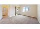 Carpeted bedroom features a window and sliding closet door at 2020 S Omaha Ave, Pahrump, NV 89048