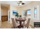 Breakfast nook with backyard views, ceiling fan, and a round table set for four at 2020 S Omaha Ave, Pahrump, NV 89048