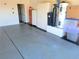 Garage with sealed concrete flooring, built-in cabinets and water equipment at 2020 S Omaha Ave, Pahrump, NV 89048
