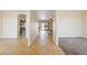 Hallway featuring tile floors leading to the kitchen, living area, and backyard at 2020 S Omaha Ave, Pahrump, NV 89048