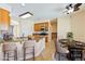Modern kitchen with an island, oak cabinets, stainless steel appliances, and a cozy dining area for Gathering meals at 2020 S Omaha Ave, Pahrump, NV 89048