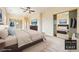 Staged bedroom features large bed, mirrored closets, and ceiling fan at 2020 S Omaha Ave, Pahrump, NV 89048