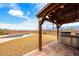 Backyard area offering a pool, desert landscaping, an outdoor kitchen, and views of the mountains at 2020 S Omaha Ave, Pahrump, NV 89048