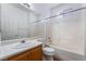 Bathroom featuring a bathtub, shower combo, toilet, and sink at 203 Sea Rim Ave, Las Vegas, NV 89148
