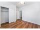 Comfortable bedroom with wooden floors, closet, and neutral walls at 203 Sea Rim Ave, Las Vegas, NV 89148