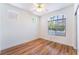 A bright bedroom featuring hardwood floors and a ceiling fan at 203 Sea Rim Ave, Las Vegas, NV 89148