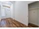 Bright foyer with wood floors, white walls, and closet space with easy access to the front door at 203 Sea Rim Ave, Las Vegas, NV 89148