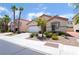 Well-maintained single-story home with desert landscaping, a two-car garage, and a red tile roof at 203 Sea Rim Ave, Las Vegas, NV 89148