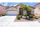 Charming single-story home with well-maintained landscaping and neutral-toned exterior at 203 Sea Rim Ave, Las Vegas, NV 89148