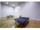 Recreation room with ping pong tables and wood floors, perfect for entertaining guests at 203 Sea Rim Ave, Las Vegas, NV 89148