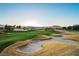 Stunning golf course features rolling green hills, sand traps, and mountain views at 203 Sea Rim Ave, Las Vegas, NV 89148